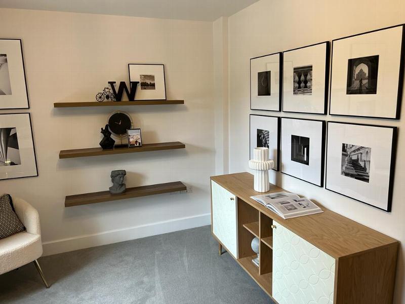 Living room with shelves and art on the wall