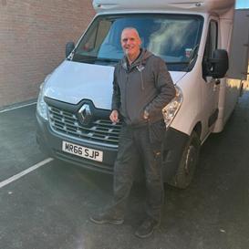 Steve Pugh, director of SJP Installations, stood next to a van